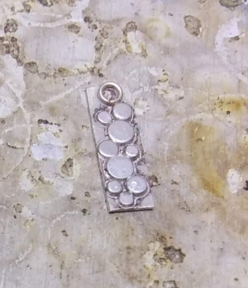 Judy Larson's Tiny Silver Charms part 1 - , Contemporary Wire Jewelry, How To Punch Holes, Hole Punching, Punch A Hole, Texturing, Butane Torch, Soldering, Solder, tiny charms